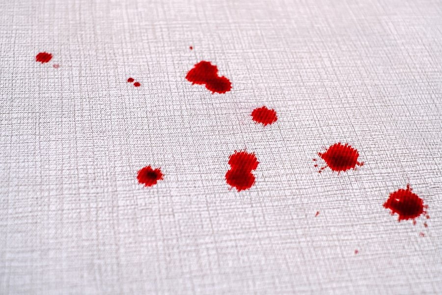 close up drops of blood on the carpet